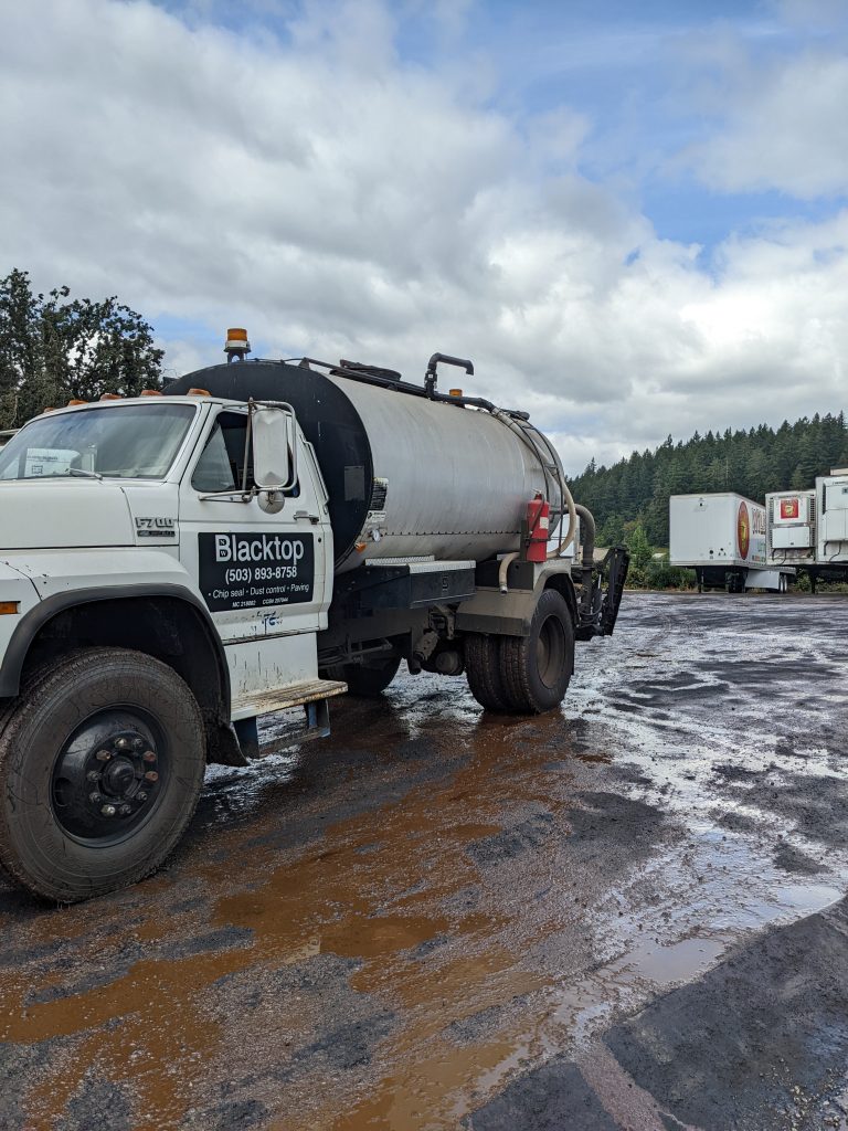 Sprayed Dust Abatement on a commercial parking lot in Clackamas, Oregon
